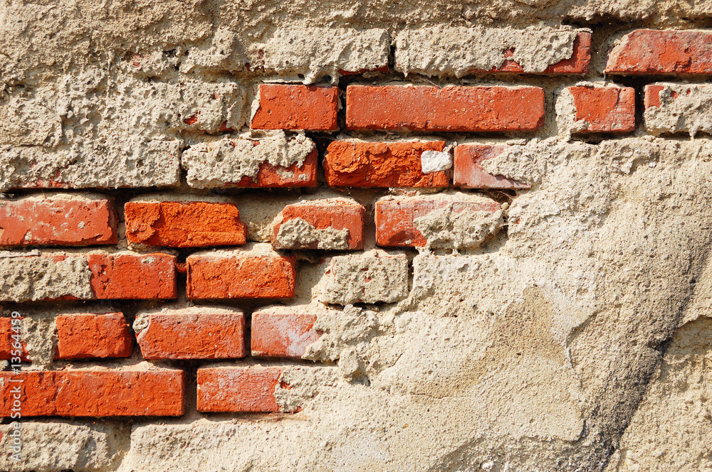 Fragment of tumbledown plastered brick wall Fragment of tumbledown plastered brick wall