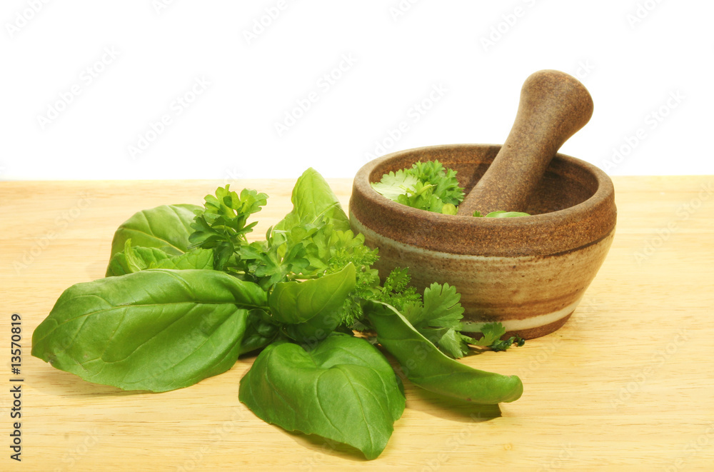 Pestle and mortar with herbs