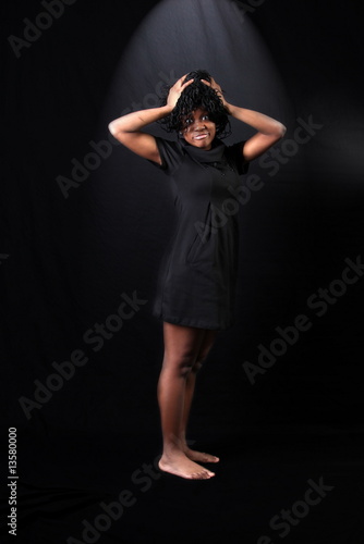 hard day - afro-american woman against black background