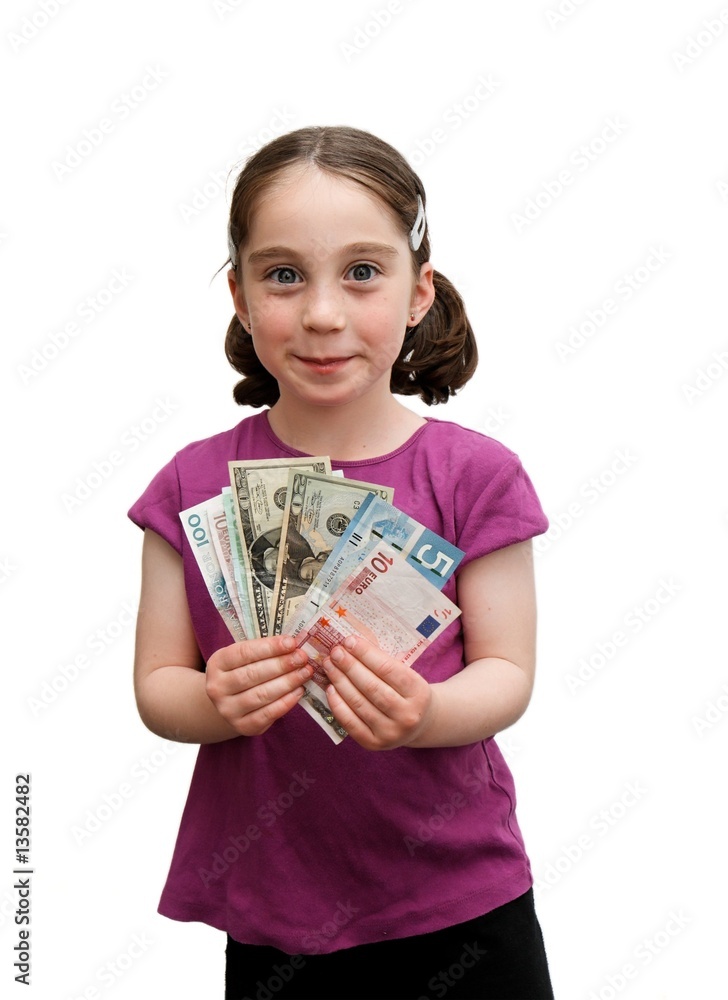 Smiling little girl with pigtails holds a fan of banknotes Smiling little girl with pigtails holds a fan of banknotes