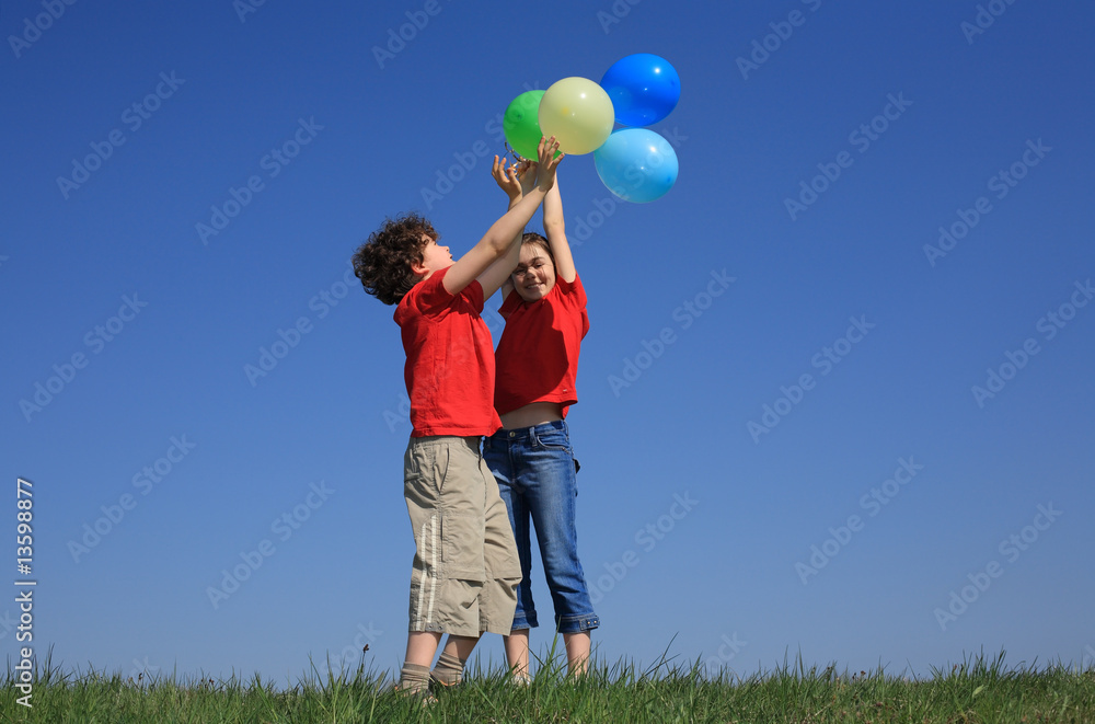 Kids holding balloons ,playing outdoor