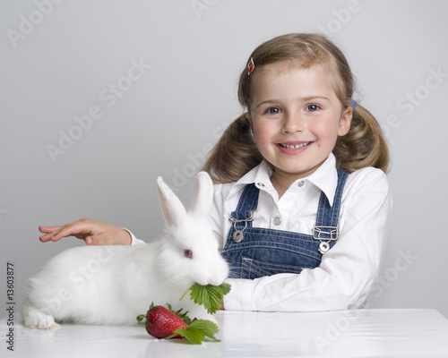 Cute girl and baby rabbit