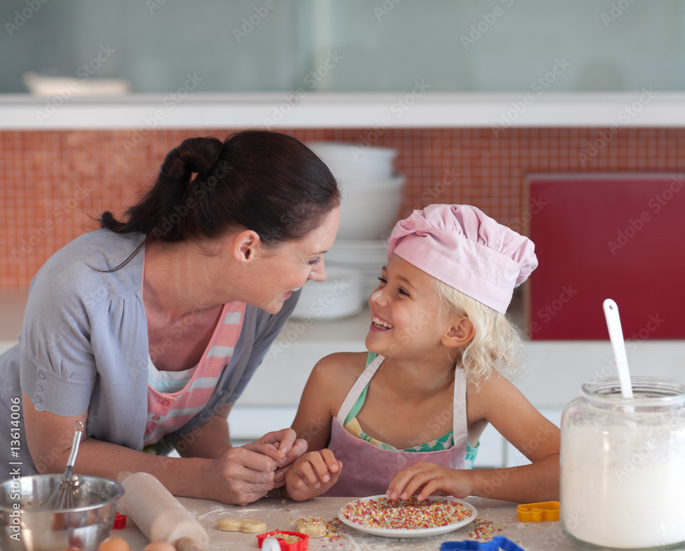 Potrait of mother and Daugther in Kitchen preparing food Potrait of mother and Daugther in Kitchen preparing food