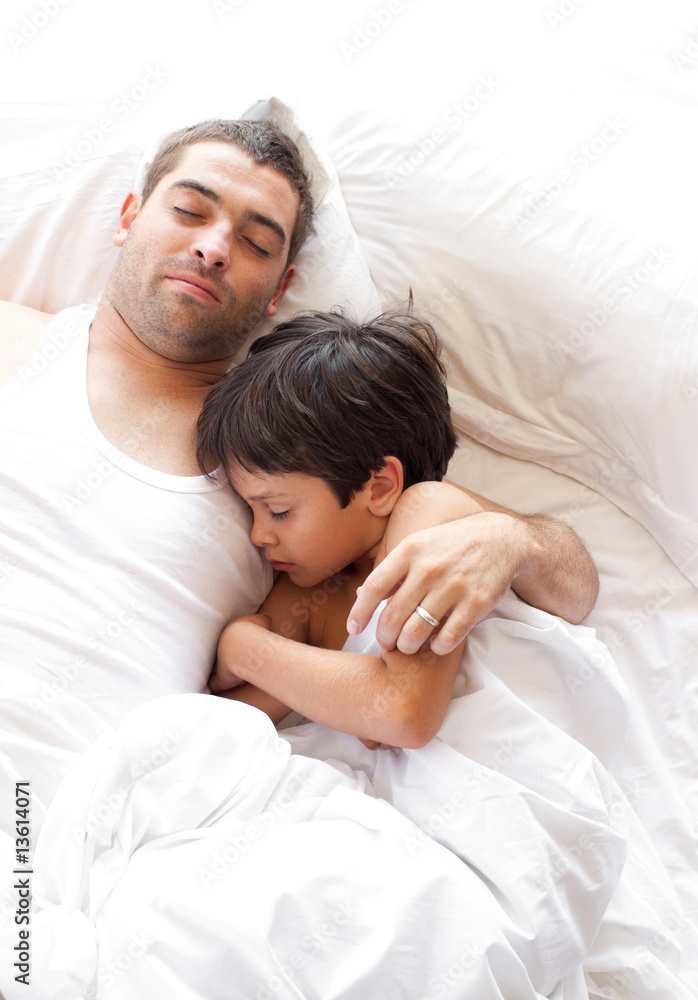 Father and Son asleep on bed Father and Son asleep on bed