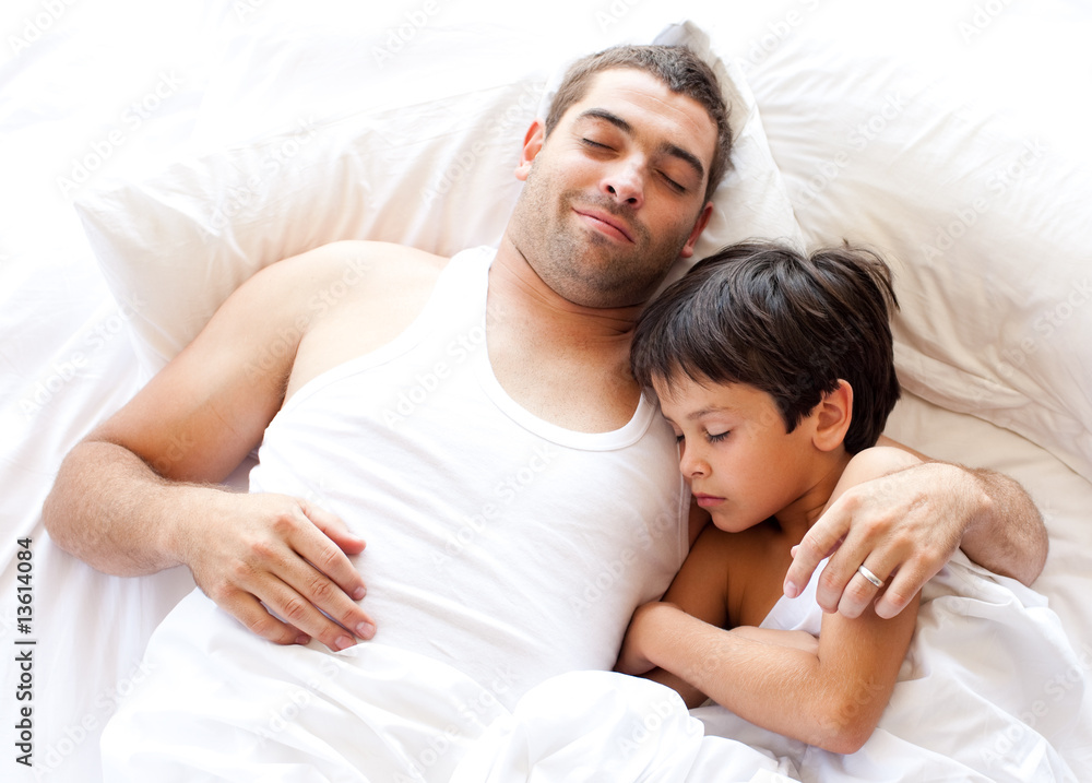father and son asleep on bed father and son asleep on bed