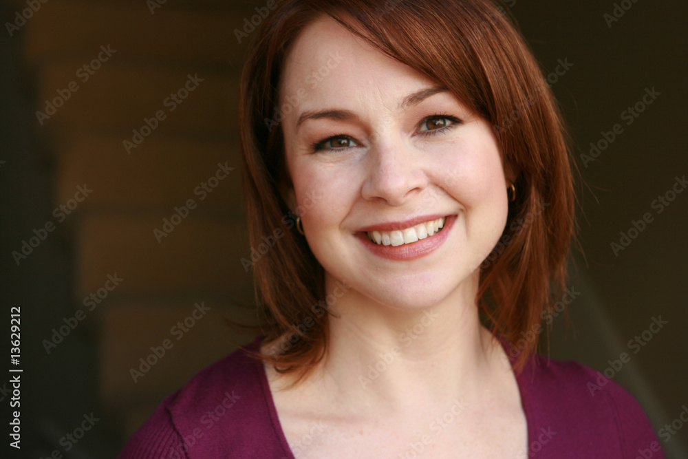 Attractive mom woman looks at camera Attractive mom woman looks at camera