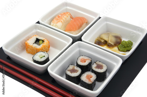 sushi in white dishes