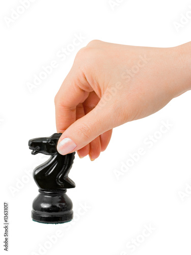 Hand with chess knight