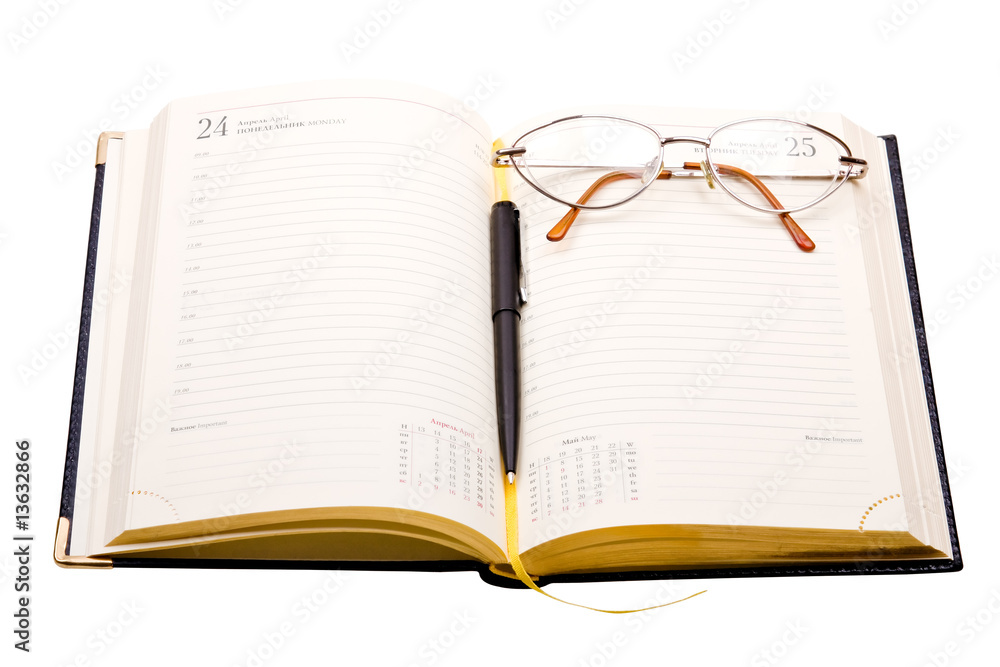 Daily planner with glasses and pen isolated on white Daily planner with glasses and pen isolated on white