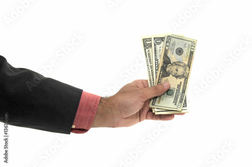 Hand with money isolated in white