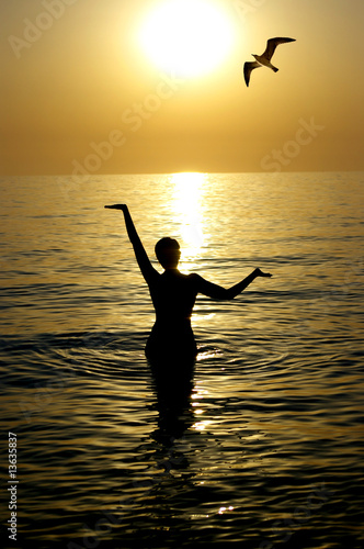 Young beatiful woman in a sea © tan4ikk