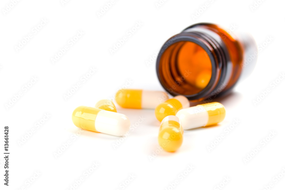 bottle with yelllow capsules bottle with yelllow capsules