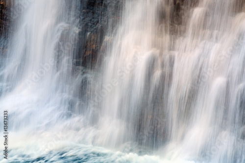 Waterfall on mountain forest © wildman