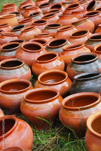 Lots of clay pots on the grass © Roman Antoschuk