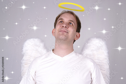Boy with wings and halo looking like a Saint