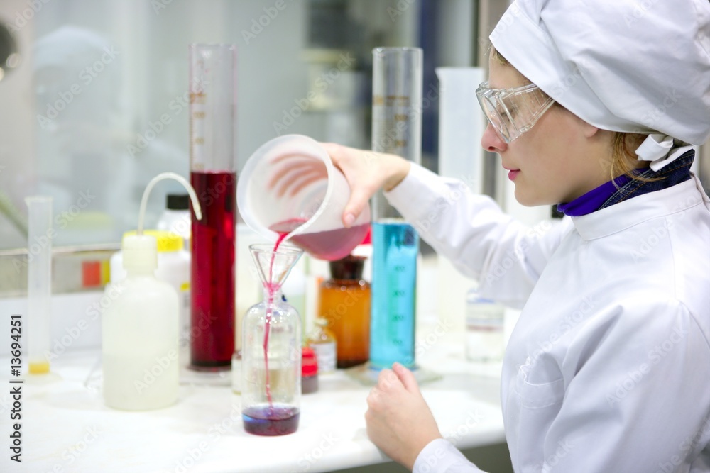 Woman working laboratory, glass cylinder vase Woman working laboratory, glass cylinder vase