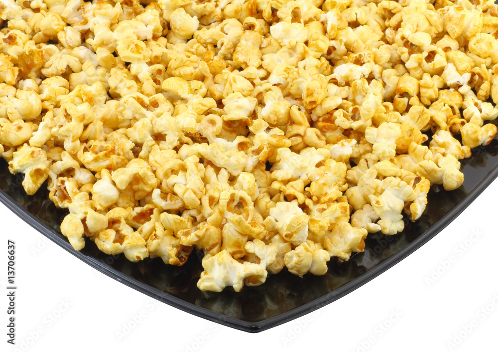 Fragment of plate with fresh caramel popcorn. Isolated Fragment of plate with fresh caramel popcorn. Isolated