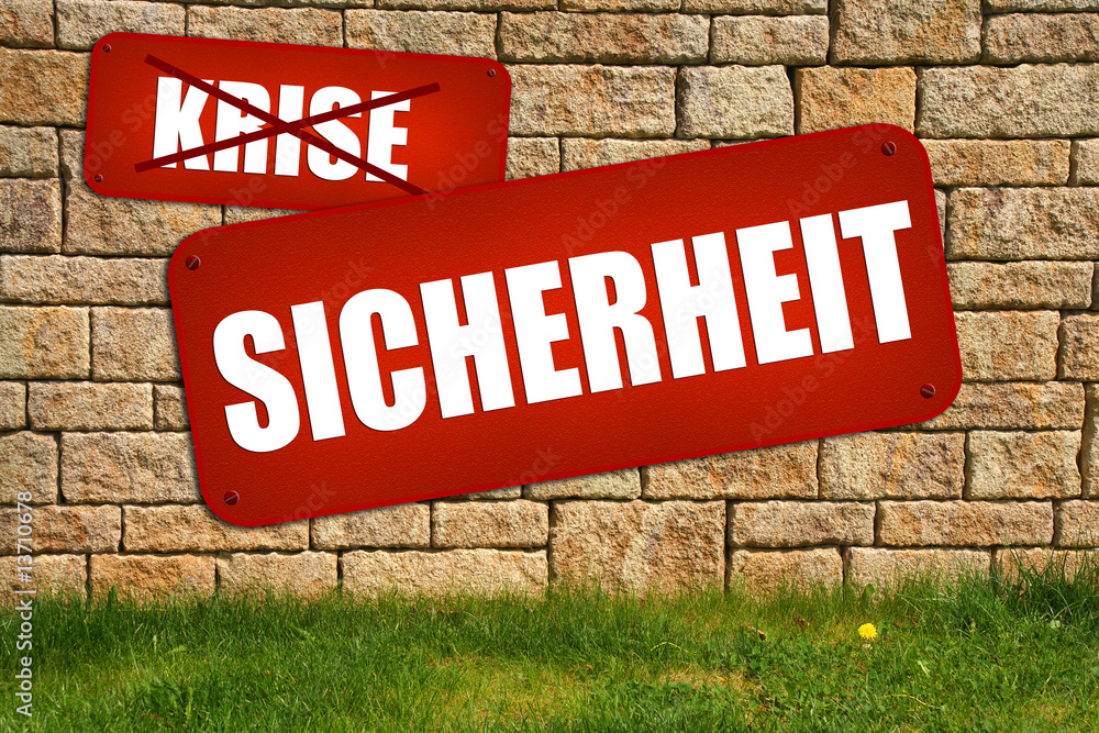 Schild an der Steinmauer Sicherheit Schild an der Steinmauer Sicherheit