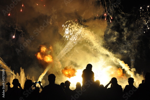 People watch a colorful  fireworks show