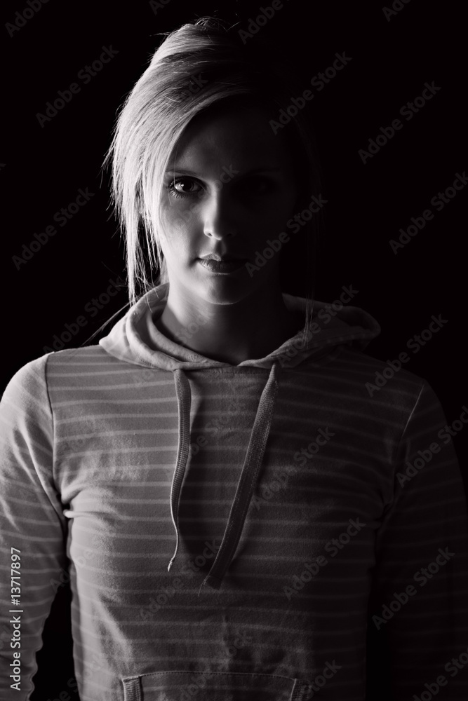Low Key Shot of a Pretty Blonde Girl in Striped Hooded Top