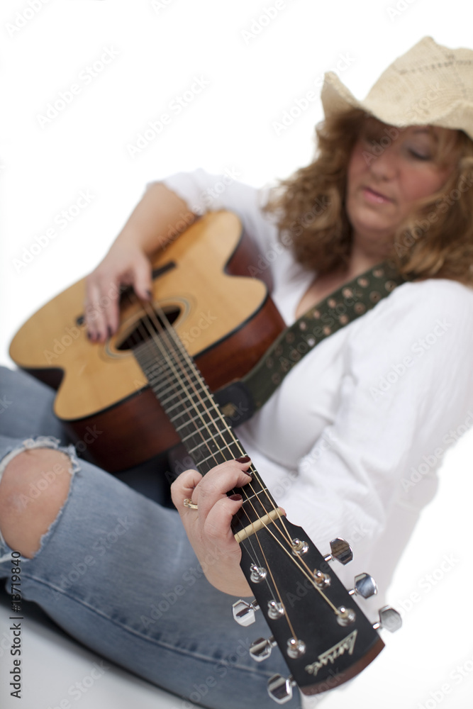 Woman Playing Guitar - selective focus on the hands Woman Playing Guitar - selective focus on the hands