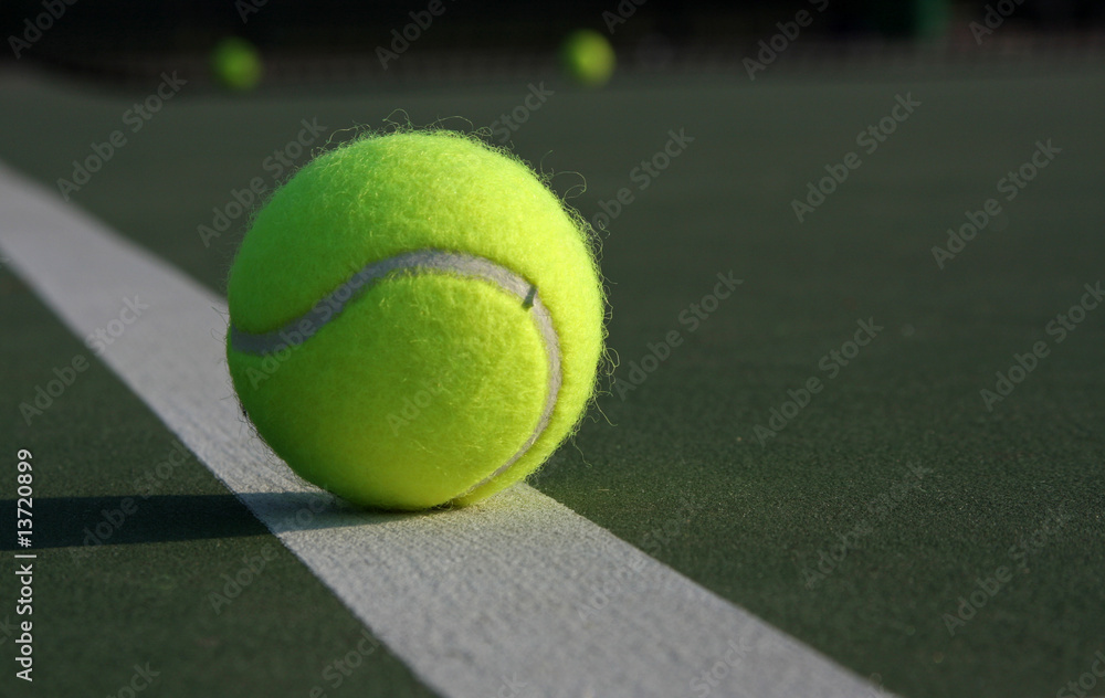 Tennis Ball on the Court Line