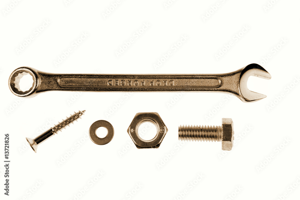 Spanner, nut and screws on white Spanner, nut and screws on white