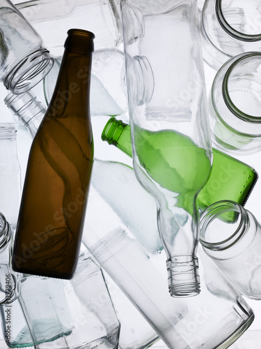 Backlit collection of glass bottles and jars