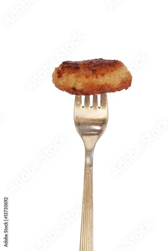 chop on fork on white background