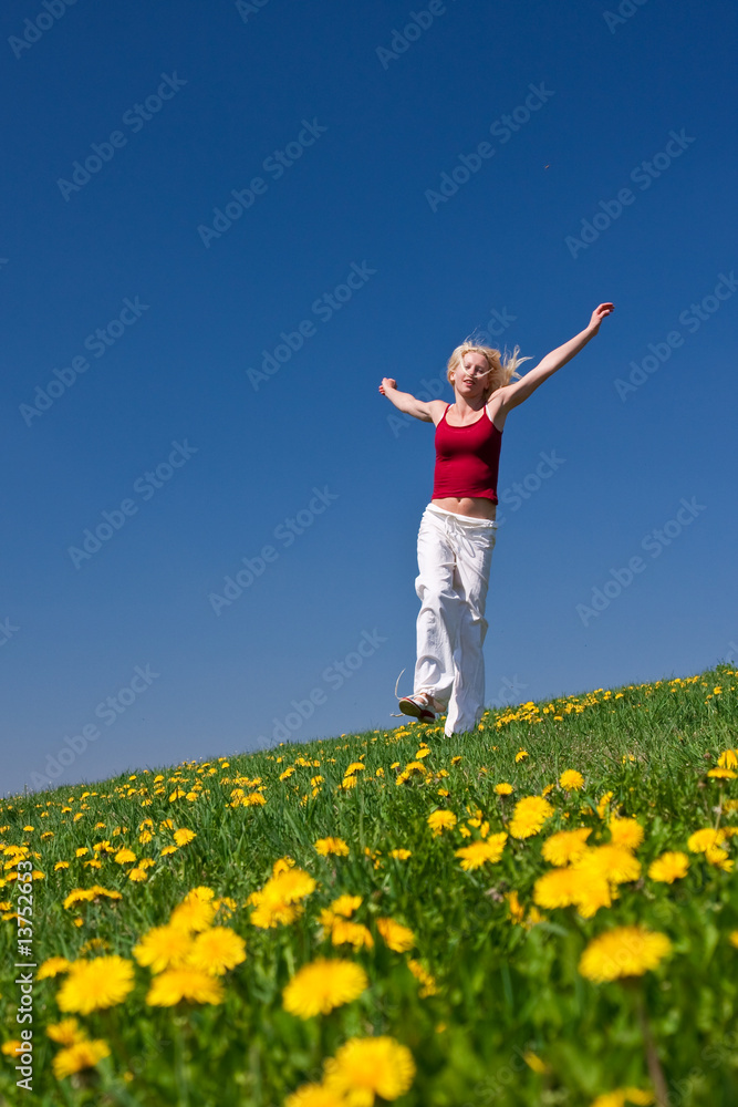 young woman in red outfit having fun on meadow young woman in red outfit having fun on meadow