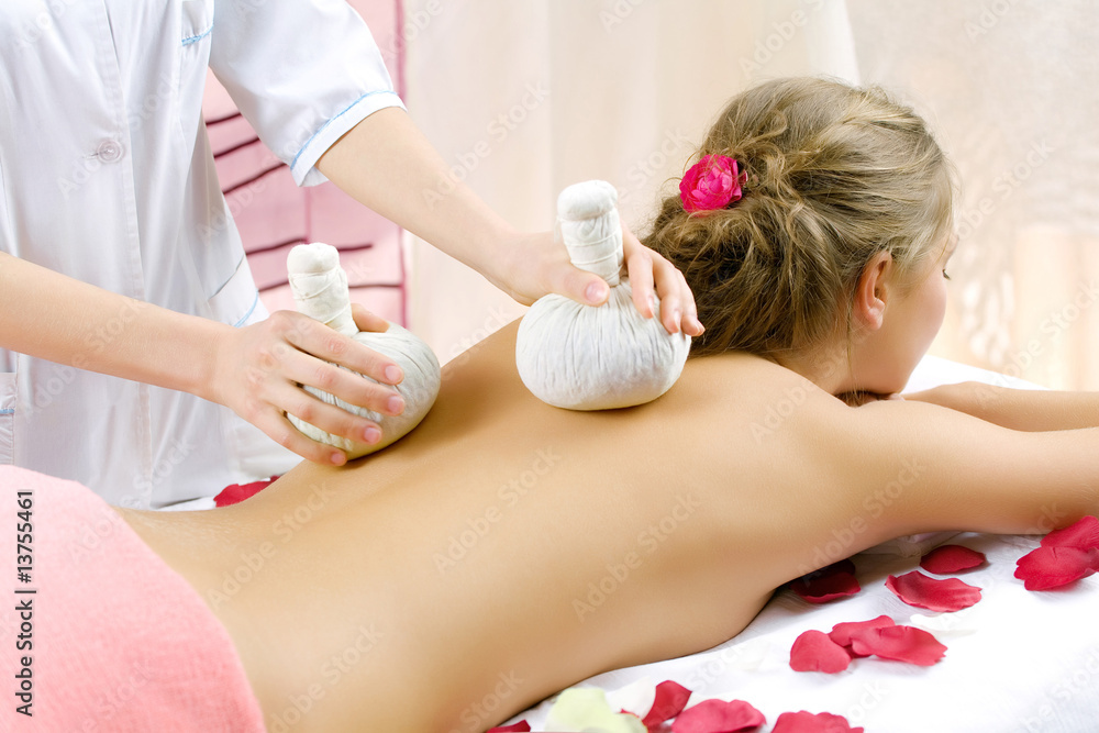 The young beautiful girl has a massage session