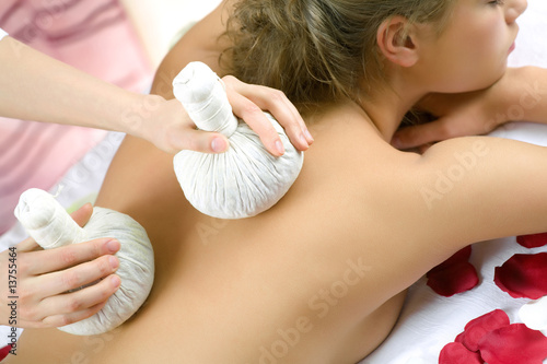 The young beautiful girl has a massage session