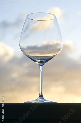 Empty Red Wine Glass Back Lit by the Setting Sun