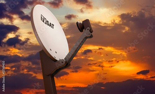 TV satellite dish over sunset sky photo