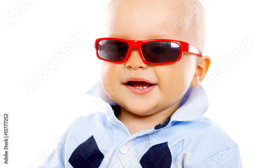 Portrait of sweet little baby boy with sunglasses