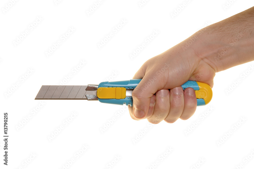 hand with cutter over white background hand with cutter over white background