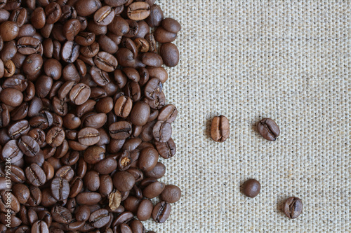 Fototapeta Naklejka Na Ścianę i Meble -  Coffee Beans On Canvas Background
