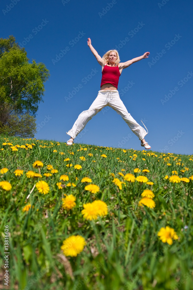young woman in red outfit having fun on meadow young woman in red outfit having fun on meadow