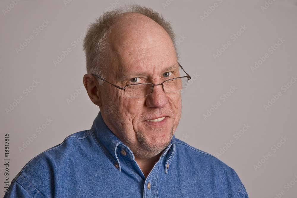 Older Man in Glasses Smiling Head Tilted Older Man in Glasses Smiling Head Tilted