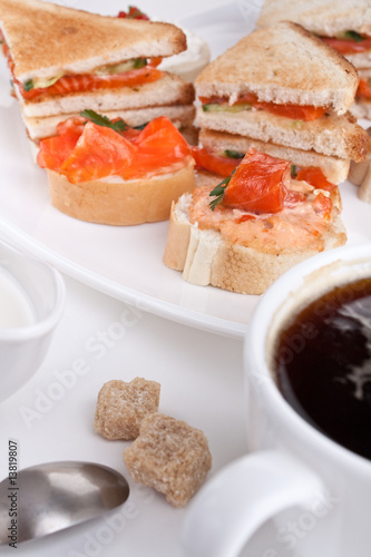 small and club salmon sandwiches and a cup of coffee