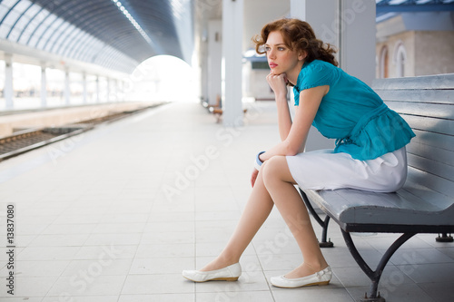 Upset girl on railway station