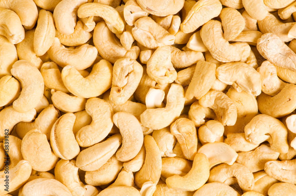 Cashew nuts arranged at the background