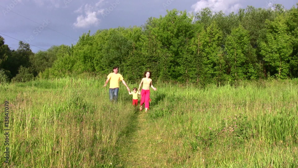 family with little girl running