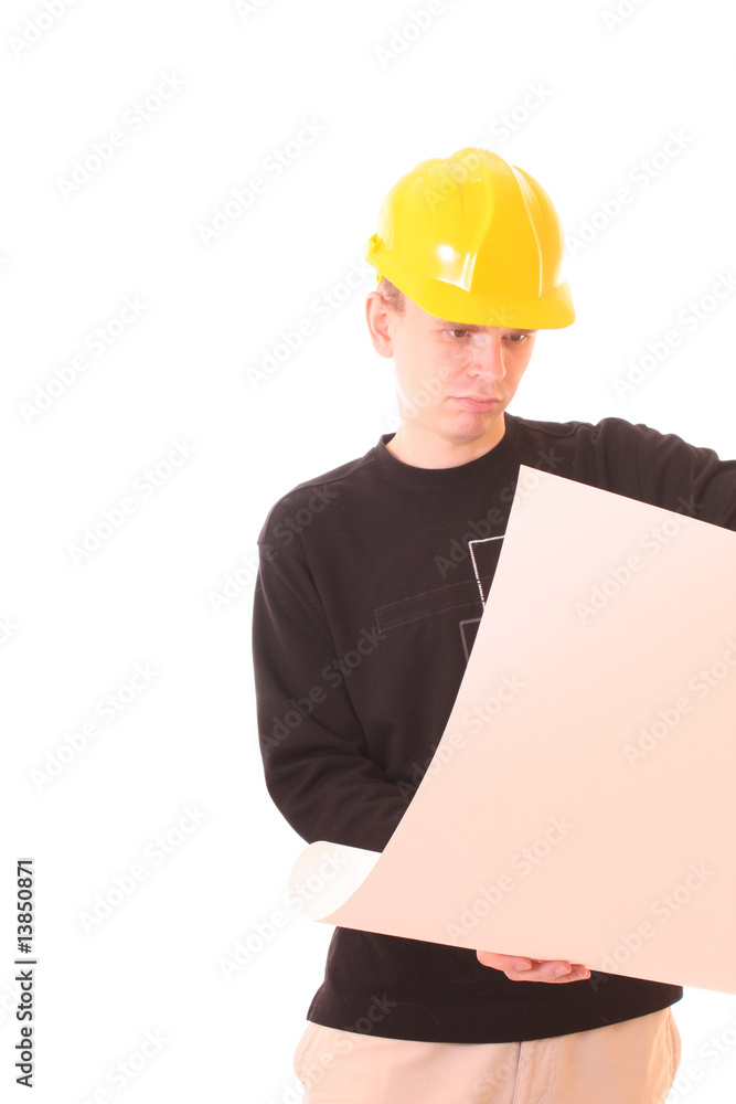 Young man with paper in yellow helmet isolated on white Young man with paper in yellow helmet isolated on white
