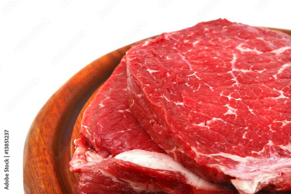 Obraz premium bloody meat on wooden plate