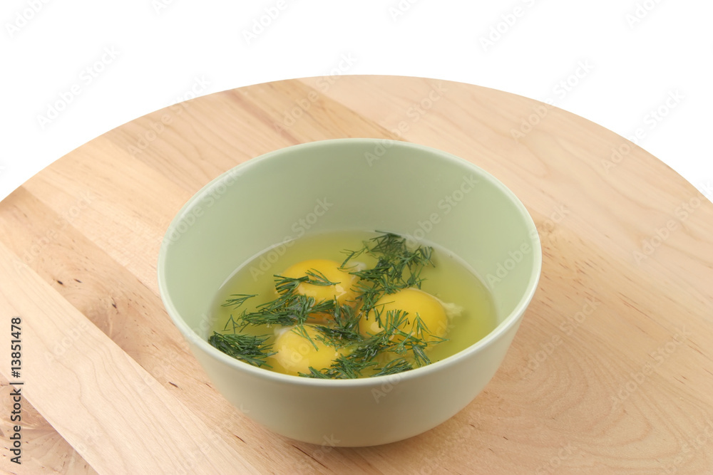 three raw broken eggs inside bowl three raw broken eggs inside bowl
