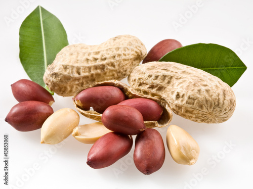 Peanut with pods and leaves on a white background.