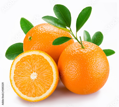 Oranges with leaves on a white background.