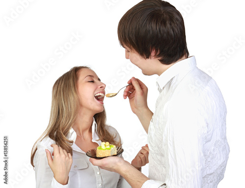A fellow feeds a girl