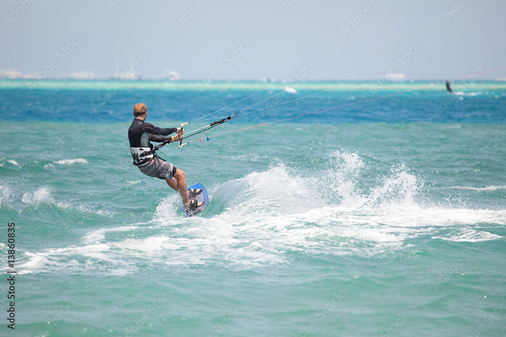 Kiteboarder surfing